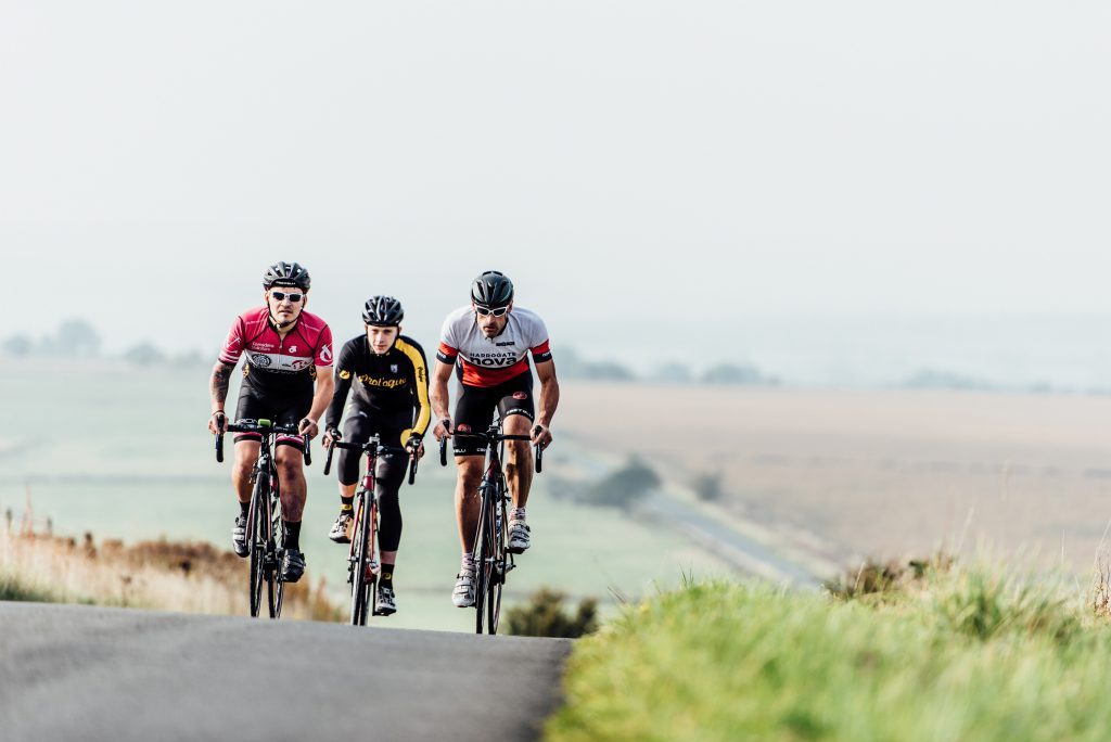 Group of cyclists take on a tough uphill cycling climb