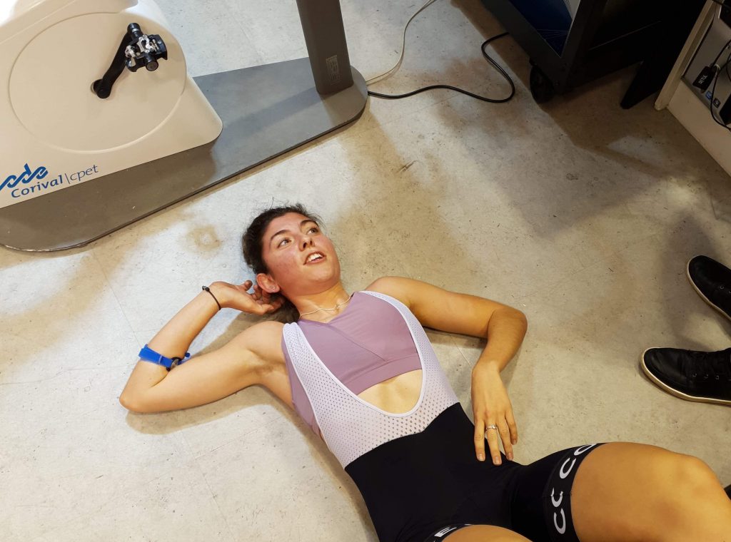Cyclist lying on the floor recovering after a VO2 Max test